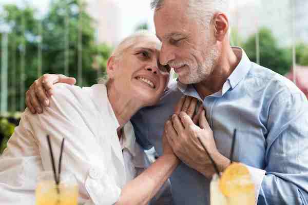 senior couple hugging each other